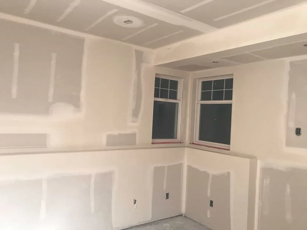 Interior of basement with drywall installed after insulation installation