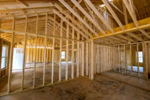 Comparison of wood and steel stud framing systems in an Edmonton construction project before drywall installation