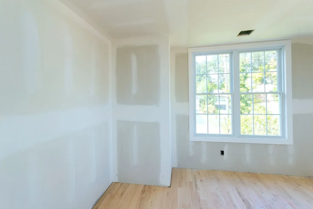 Drywall contractor reviewing interior wall plans for an Edmonton renovation