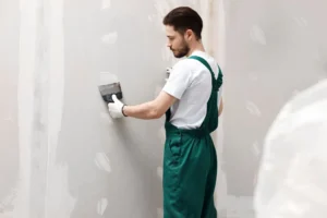 Drywall finishing in Edmonton with joint compound drying under controlled indoor temperature and humidity conditions