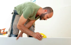 Comparison of 1/2-inch and 5/8-inch drywall panels showing thickness differences for walls and ceilings.